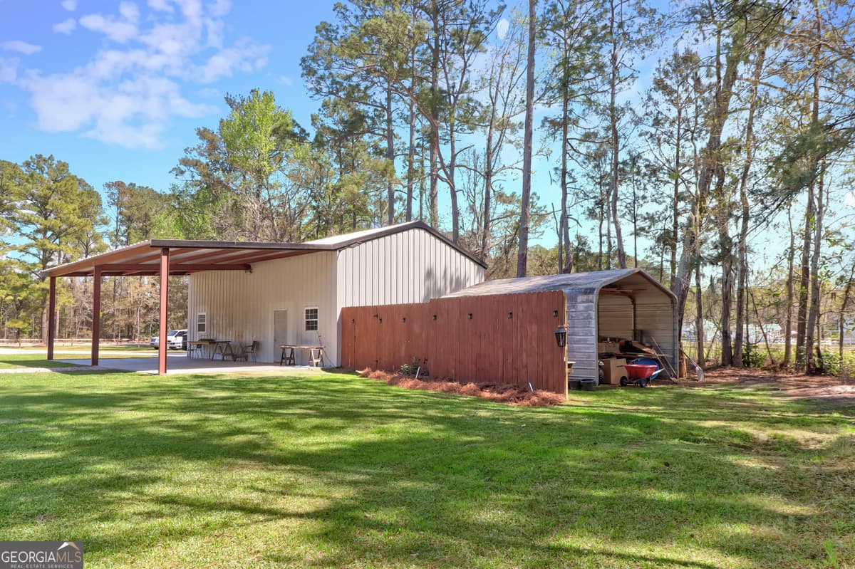 5 bedroom, 3.5 bathroom, 5,775 sq ft single family residence for sale at 3064 Little McCall Road, Rincon, GA 31326 — photo 10