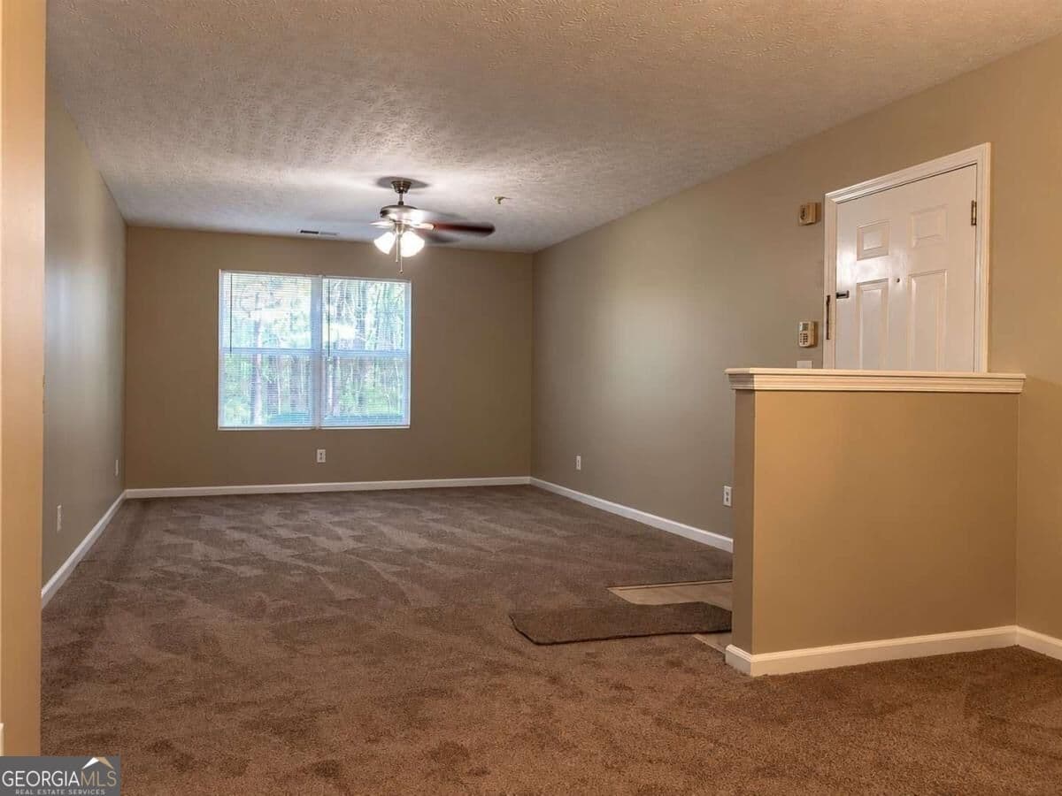 3 bedroom, 2 bathroom, 1,202 sq ft condominium for sale at 4103 Par Three Way, Lithonia, GA 30038 — photo 2