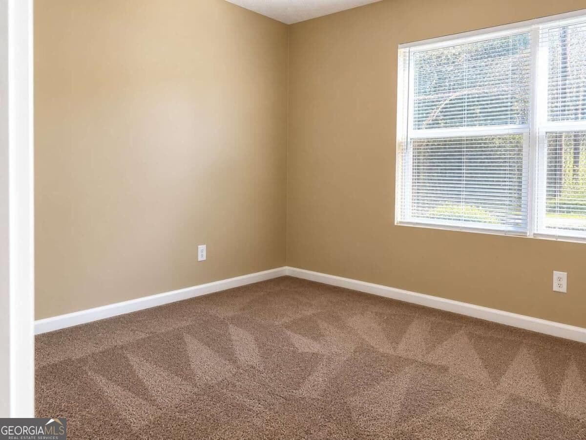 3 bedroom, 2 bathroom, 1,202 sq ft condominium for sale at 4103 Par Three Way, Lithonia, GA 30038 — photo 6