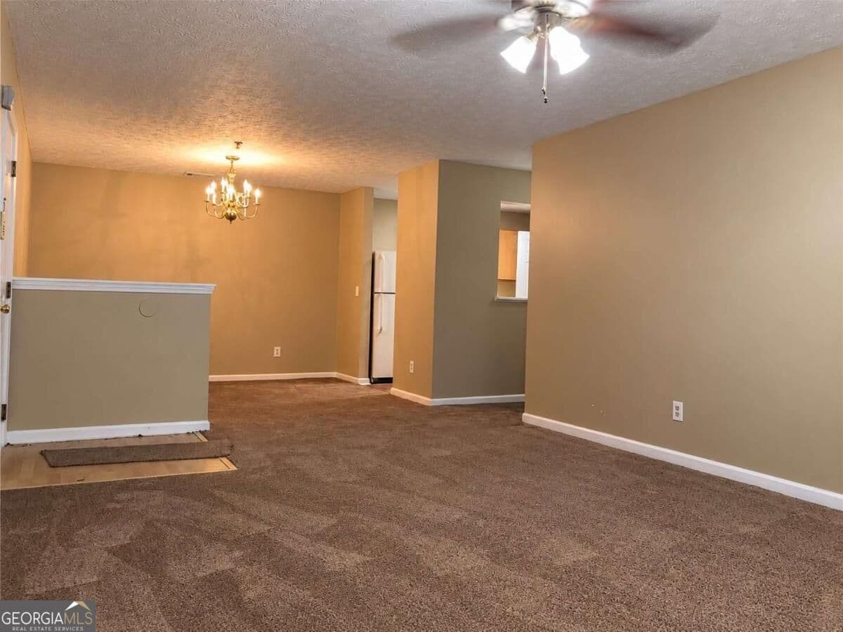 3 bedroom, 2 bathroom, 1,202 sq ft condominium for sale at 4103 Par Three Way, Lithonia, GA 30038 — photo 1 of 11