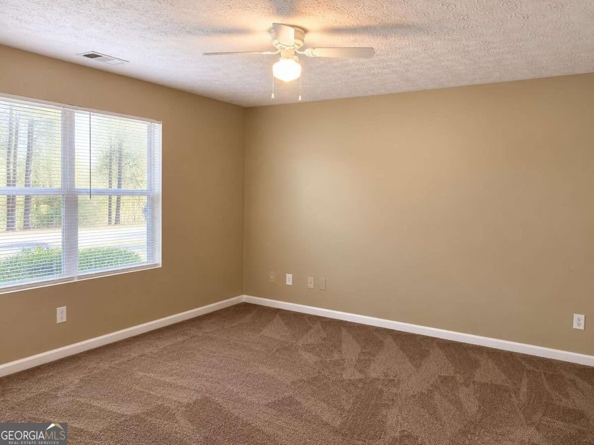 3 bedroom, 2 bathroom, 1,202 sq ft condominium for sale at 4103 Par Three Way, Lithonia, GA 30038 — photo 9