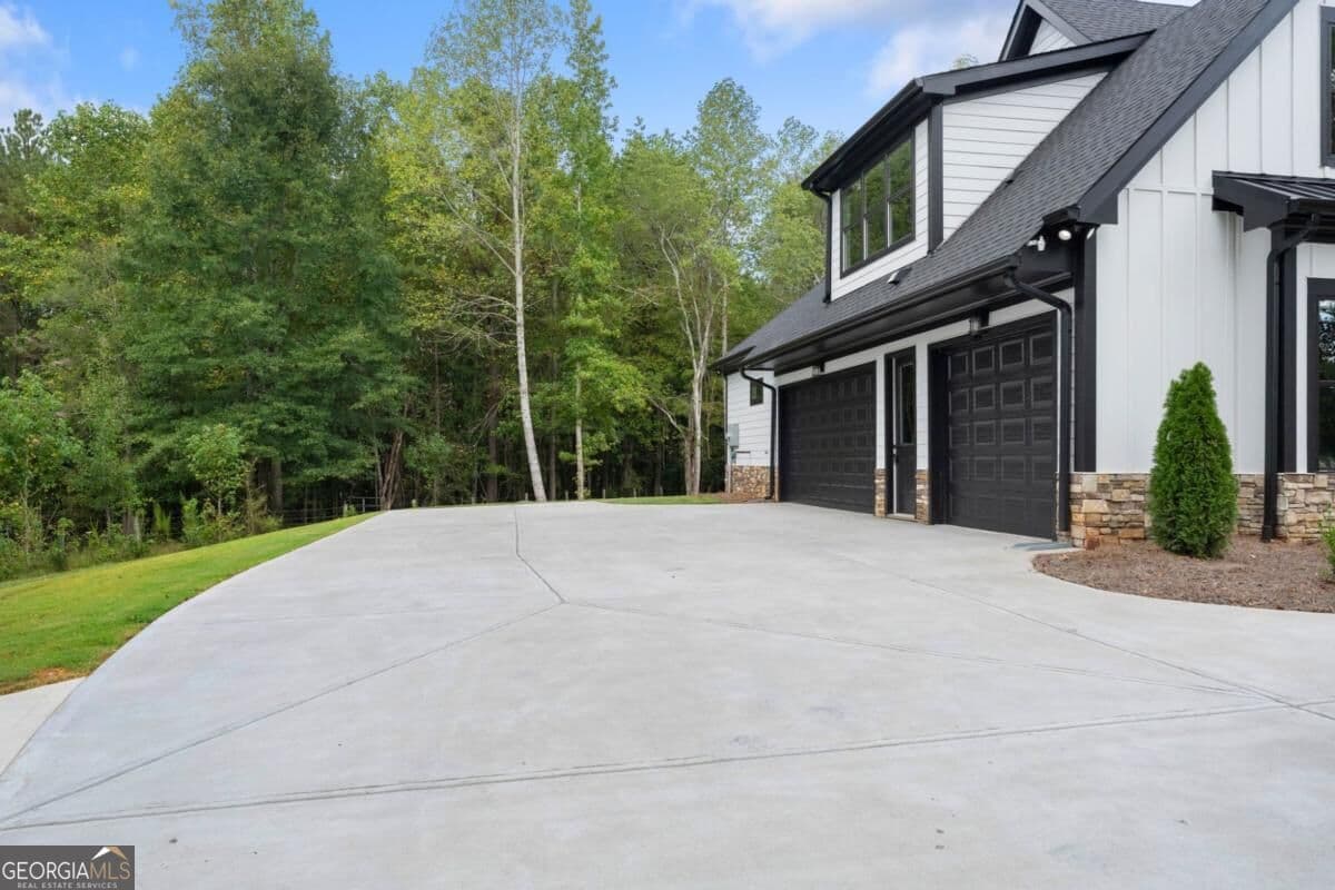 5 bedroom, 5.5 bathroom single family residence for sale at 5697 Ball Ground Road, Ball Ground, GA 30107 — photo 4
