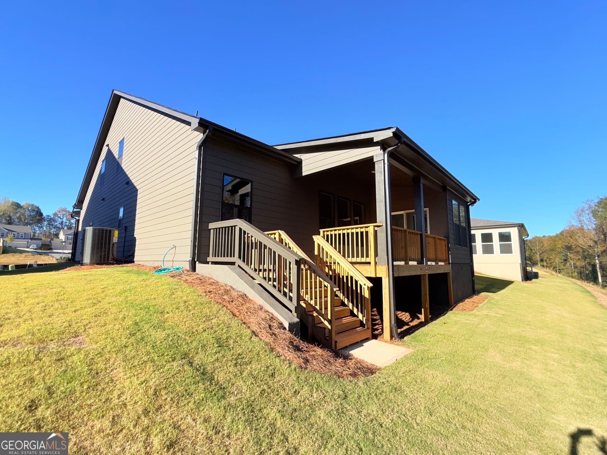 4 bedroom, 3.5 bathroom, 3,121 sq ft single family residence for sale at 5535 Tullis Drive, Gainesville, GA 30507 — photo 6