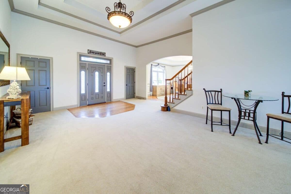 4 bedroom, 3.5 bathroom, 6,892 sq ft single family residence for sale at 6462 Waterscape Ridge, Gainesville, GA 30506 — photo 4