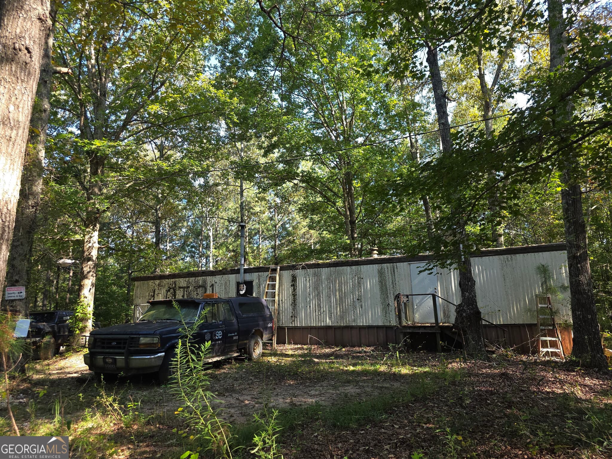 8 bedroom, 4 bathroom, 720 sq ft manufactured home,single family residence for sale at 3585 Old Hwy 100, Tallapoosa, GA 30176 — photo 2