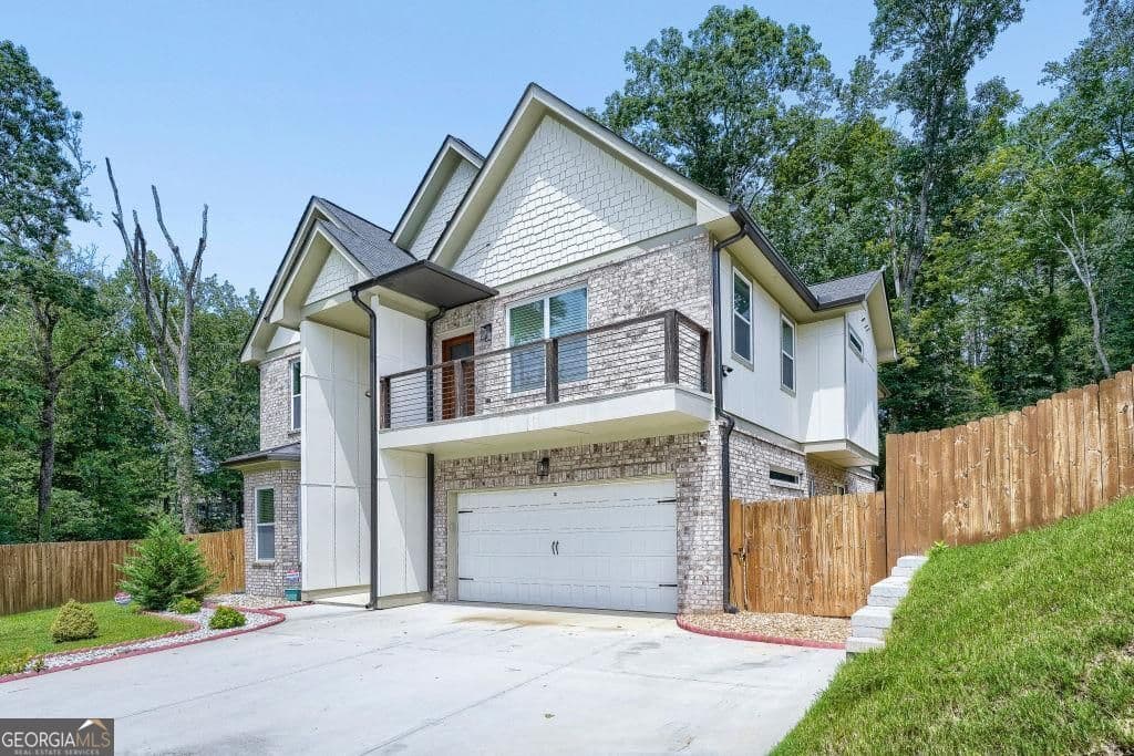 6 bedroom, 5 bathroom, 3,543 sq ft single family residence for sale at 658 Rockbridge Road, Lilburn, GA 30047 — photo 2