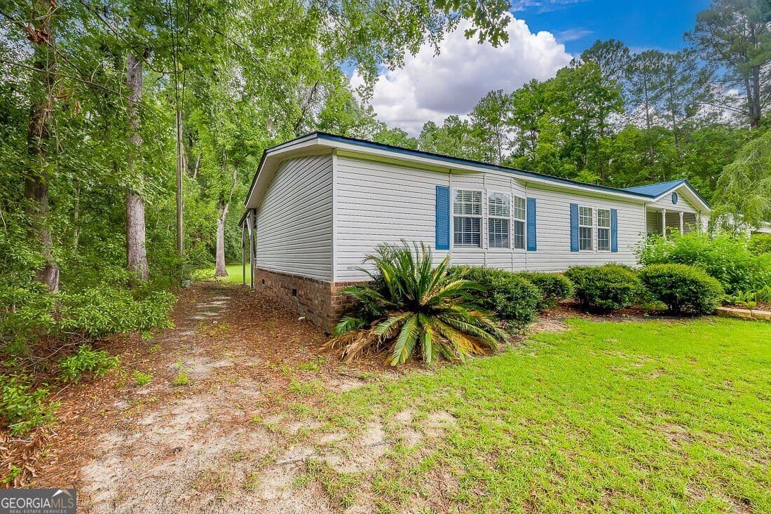 3 bedroom, 2 bathroom, 2,184 sq ft manufactured home,single family residence for sale at 3555 Noel C Conaway Road, Guyton, GA 31312 — photo 4