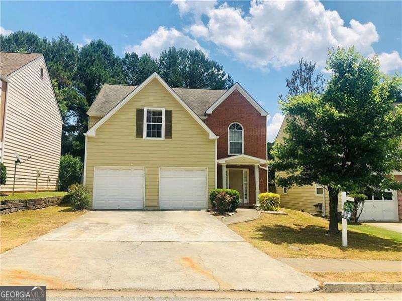 3 bedroom, 2.5 bathroom, 2,121 sq ft single family residence for sale at 5280 Harbins Point Lane, Lilburn, GA 30047 — photo 2