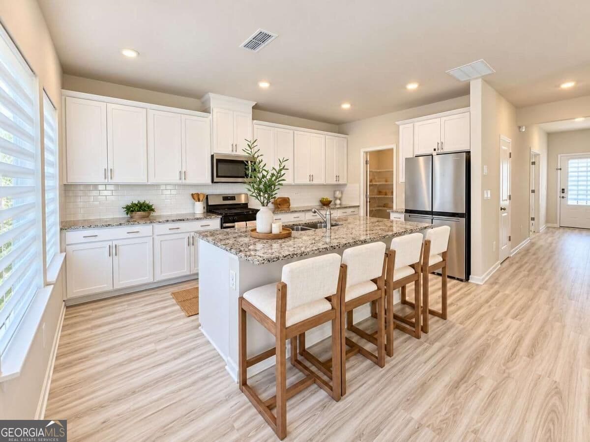 4 bedroom, 2.5 bathroom single family residence for sale at 3774 Commodore Court, Buford, GA 30519 — photo 6