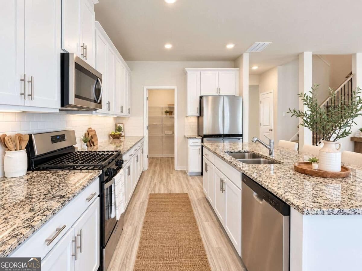4 bedroom, 2.5 bathroom single family residence for sale at 3774 Commodore Court, Buford, GA 30519 — photo 7