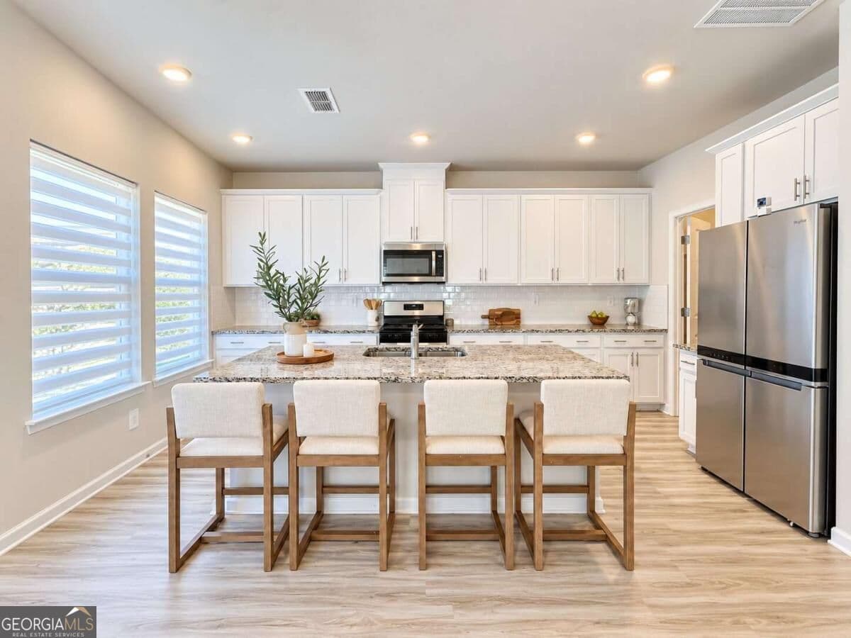 4 bedroom, 2.5 bathroom single family residence for sale at 3774 Commodore Court, Buford, GA 30519 — photo 5