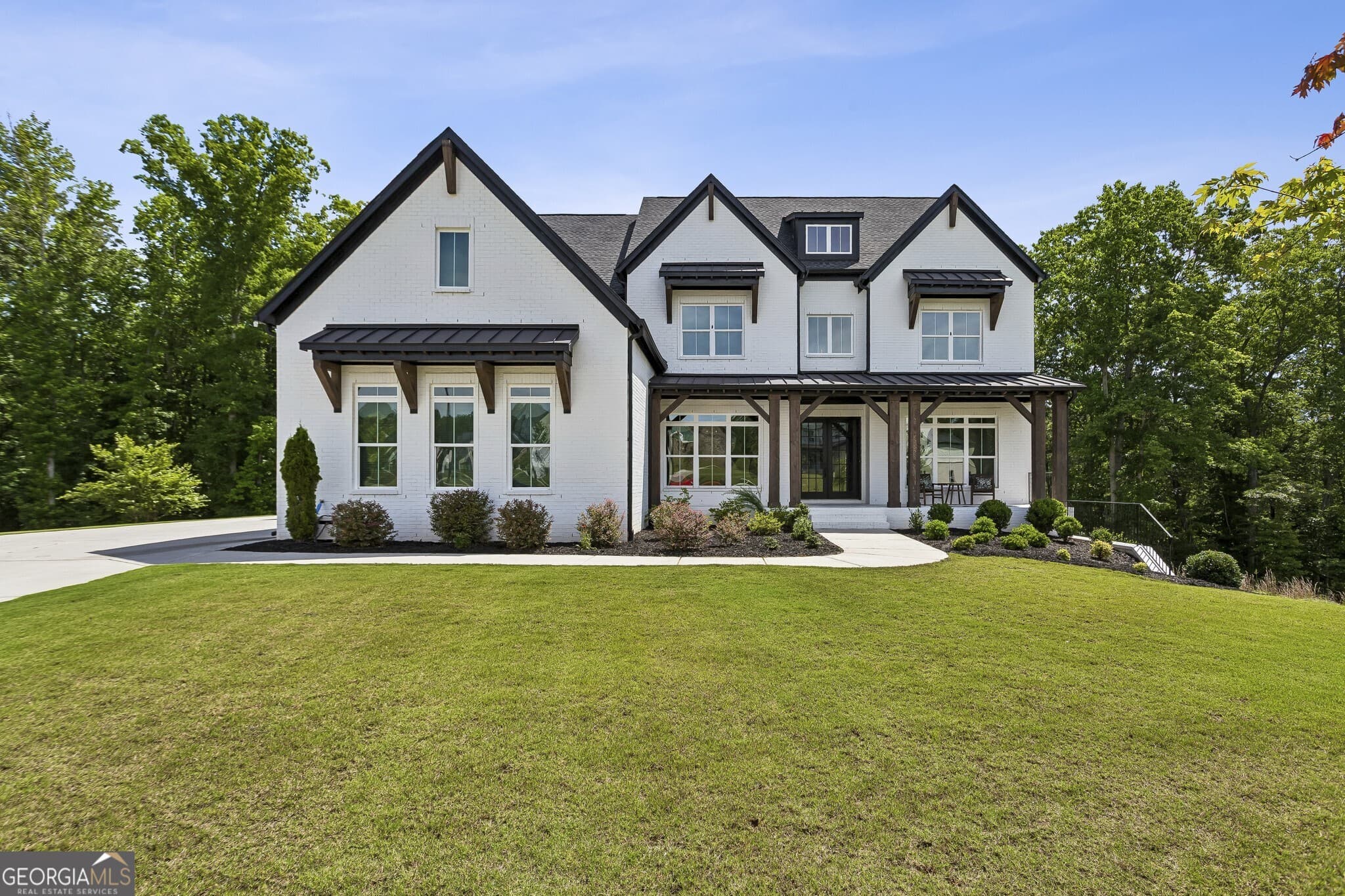 6 bedroom, 5.5 bathroom, 6,521 sq ft single family residence for sale at 423 Oakleigh Avenue, Woodstock, GA 30188 — photo 1 of 74
