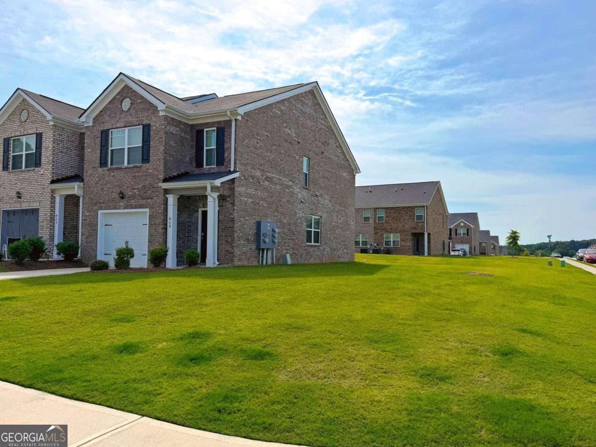3 bedroom, 2.5 bathroom, 1,516 sq ft townhouse for sale at 615 Dairy Drive, Stockbridge, GA 30281 — photo 2