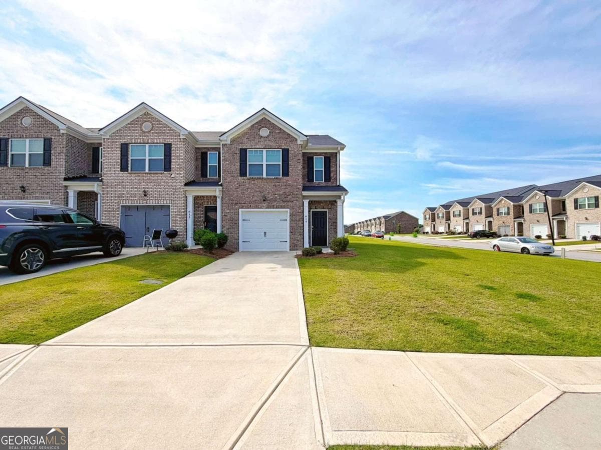 3 bedroom, 2.5 bathroom, 1,516 sq ft townhouse for sale at 615 Dairy Drive, Stockbridge, GA 30281 — photo 1 of 22