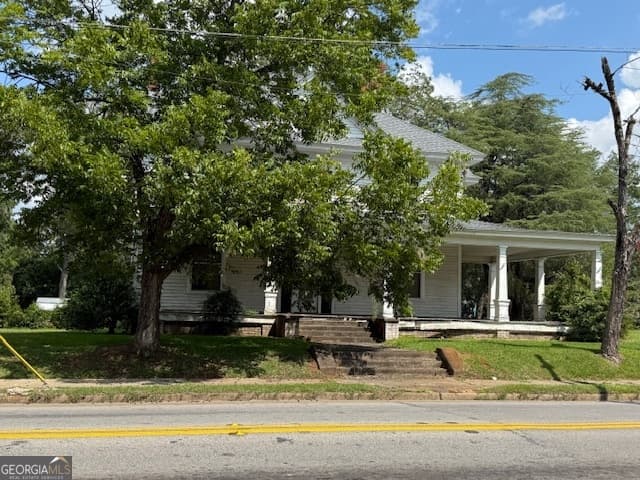 7 bedroom, 5 bathroom, 4,096 sq ft single family residence for sale at 302 N Harris Street, Sandersville, GA 31082 — photo 2
