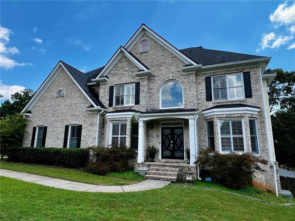 7 bedroom, 5 bathroom, 5,358 sq ft single family residence sold at 611 Montglade Court, Suwanee, GA 30024