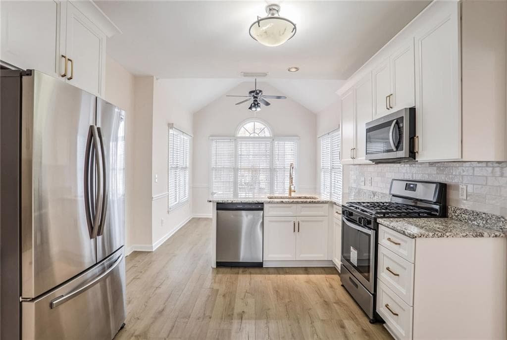 4 bedroom, 3 bathroom, 2,307 sq ft single family residence for sale at 1547 Welch Court, Suwanee, GA 30024 — photo 6