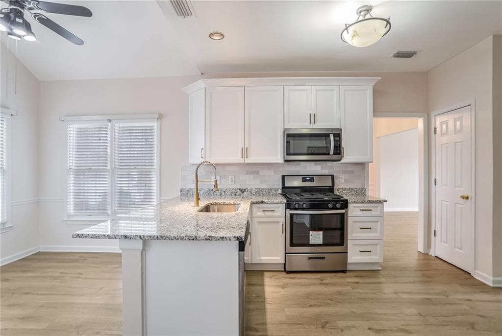 4 bedroom, 3 bathroom, 2,307 sq ft single family residence for sale at 1547 Welch Court, Suwanee, GA 30024 — photo 7