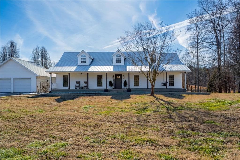 4 bedroom, 3 bathroom, 4,716 sq ft single family residence sold at 6147 Dahlonega Highway, Clermont, GA 30527