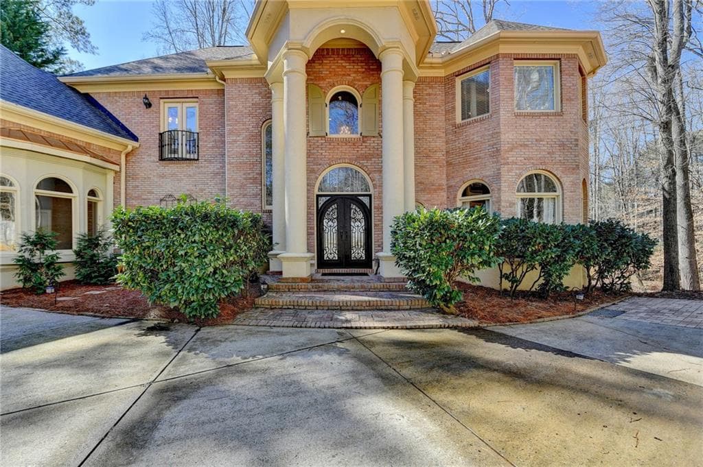 5 bedroom, 6 bathroom, 5,953 sq ft single family residence sold at 150 Stone Pond Lane, Johns Creek, GA 30022