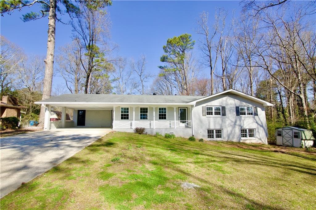 4 bedroom, 2 bathroom single family residence sold at 2447 Old Peachtree Road, Duluth, GA 30097