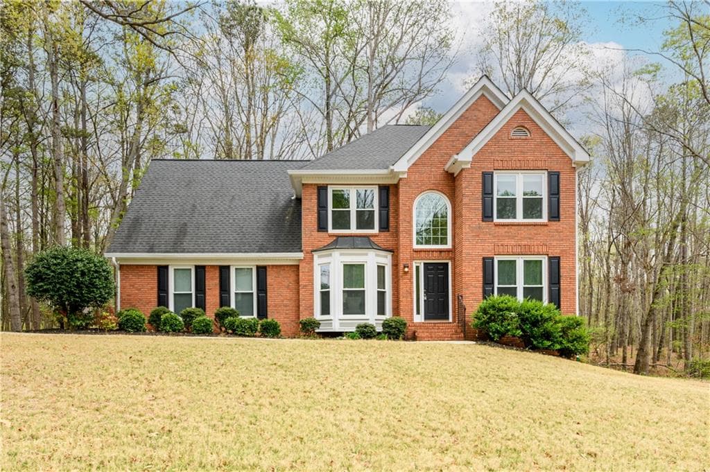 4 bedroom, 3 bathroom single family residence sold at 1885 Oak Wind Lane, Buford, GA 30519