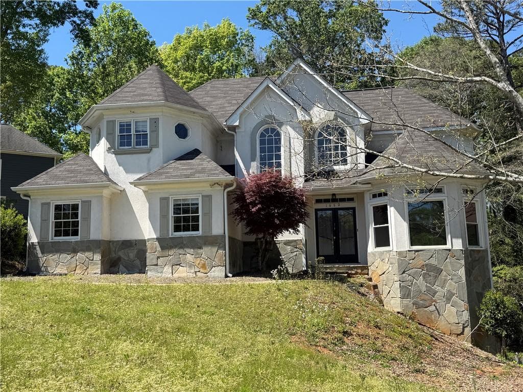 5 bedroom, 3 bathroom single family residence sold at 1660 Laurel Creek Drive, Lawrenceville, GA 30043