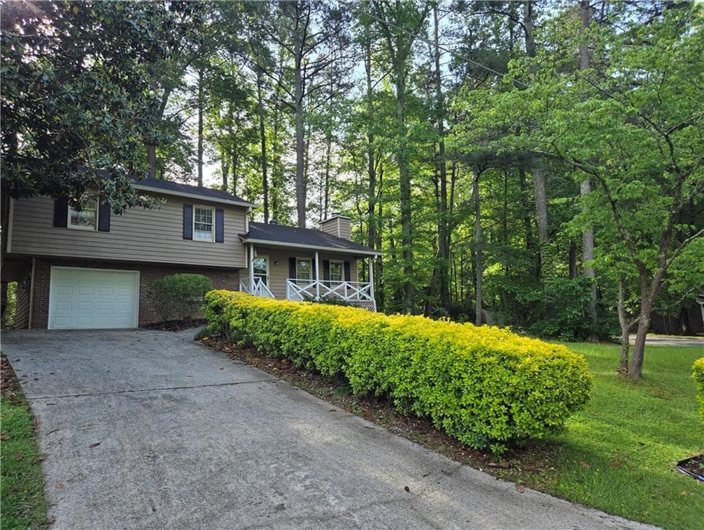 3 bedroom, 2 bathroom single family residence sold at 4015 Woodland Drive, Kennesaw, GA 30152