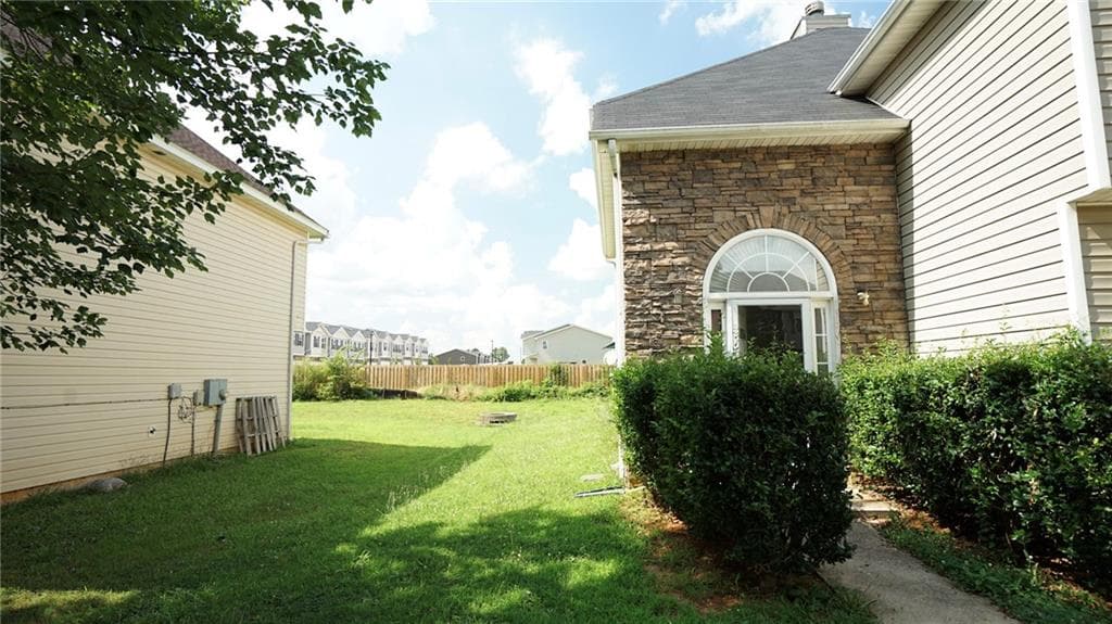 4 bedroom, 3 bathroom, 2,296 sq ft single family residence for sale at 11854 Registry Boulevard, Hampton, GA 30228 — photo 3