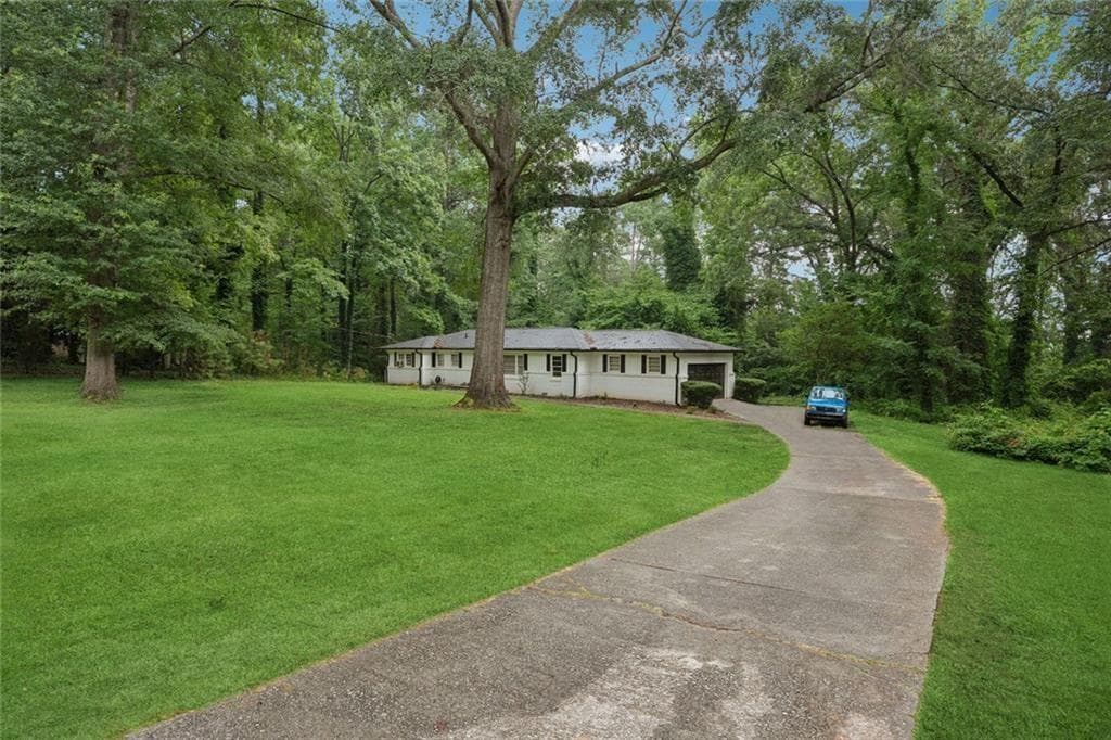 4 bedroom, 2 bathroom, 2,184 sq ft single family residence for sale at 4136 Weelaunee Road, Ellenwood, GA 30294 — photo 2