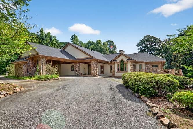 7 bedroom, 6 bathroom, 5,988 sq ft single family residence for sale at 2551 E Maddox Road, Buford, GA 30519