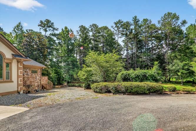 7 bedroom, 6 bathroom, 5,988 sq ft single family residence for sale at 2551 E Maddox Road, Buford, GA 30519 — photo 2