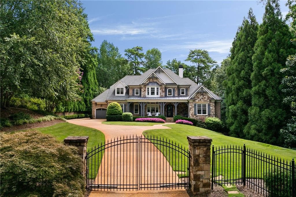 5 bedroom, 8 bathroom, 7,647 sq ft single family residence sold at 5575 Lake Island Drive, Atlanta, GA 30327