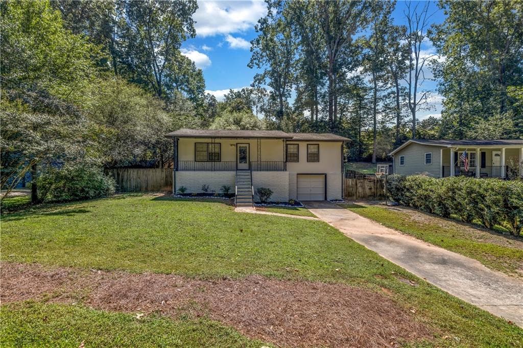 4 bedroom, 2 bathroom, 1,075 sq ft single family residence sold at 2489 Woodland Drive, Kennesaw, GA 30152
