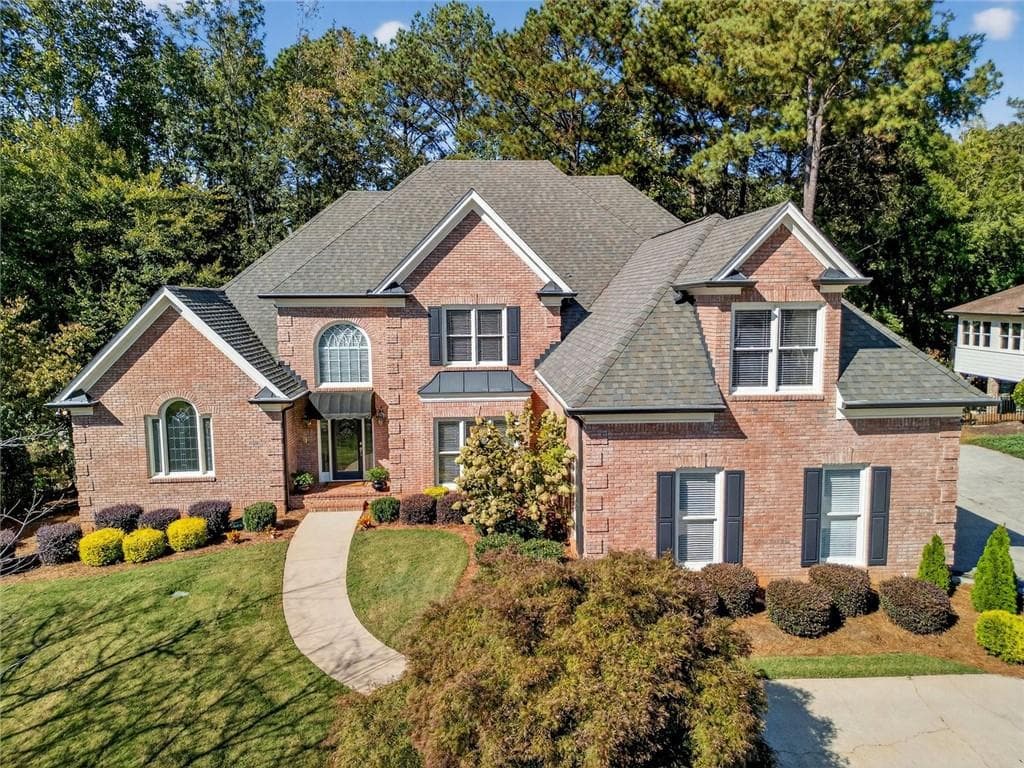 4 bedroom, 5 bathroom, 6,696 sq ft single family residence sold at 6465 Polo Drive, Cumming, GA 30040