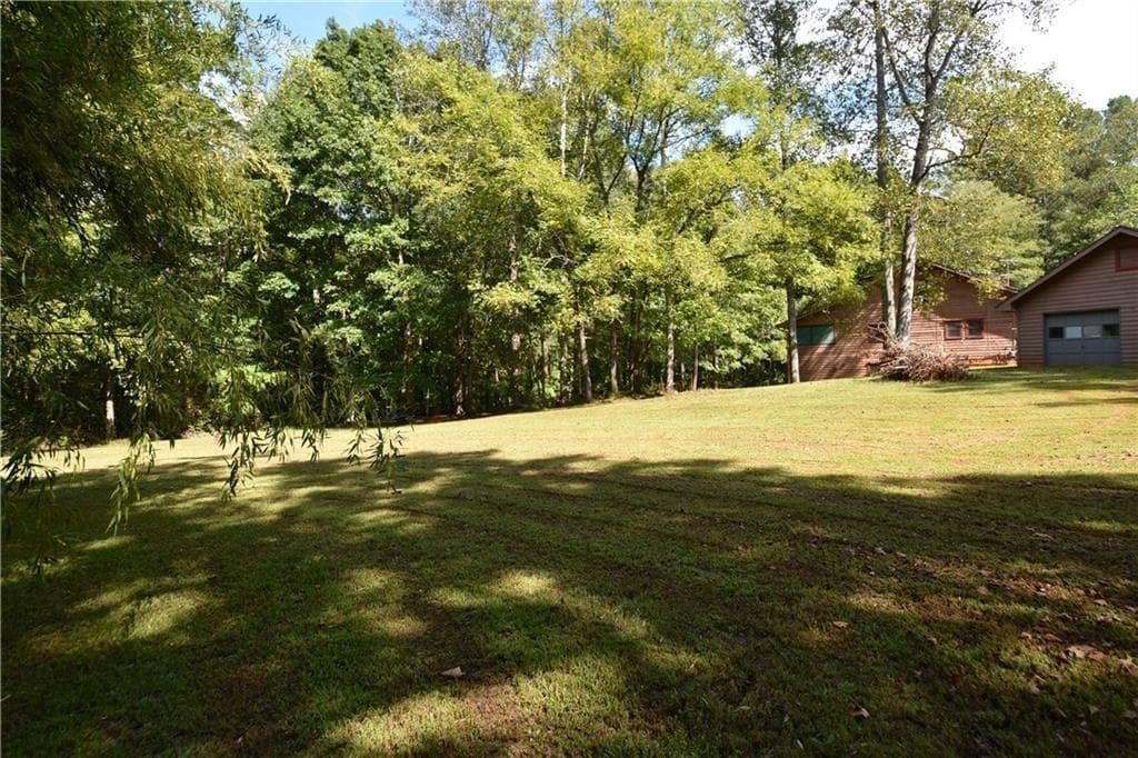 4 bedroom, 3 bathroom, 2,240 sq ft single family residence for sale at 15430 Thompson Road, Alpharetta, GA 30004 — photo 4