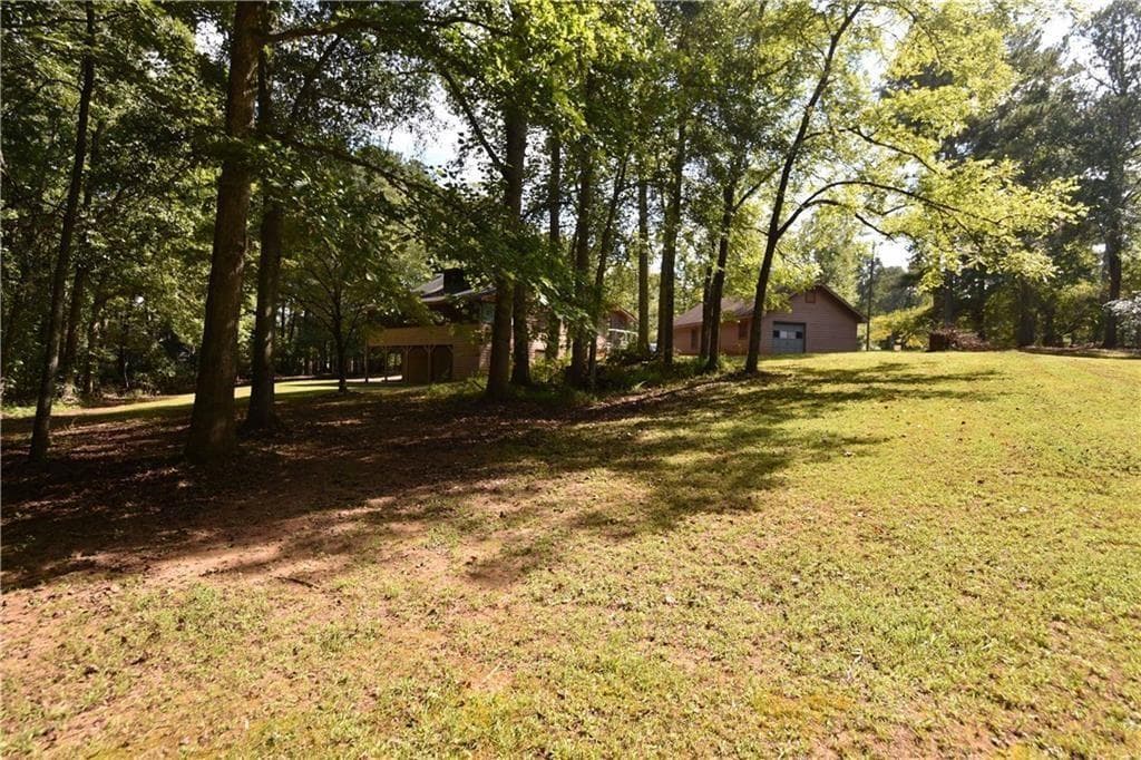 4 bedroom, 3 bathroom, 2,240 sq ft single family residence for sale at 15430 Thompson Road, Alpharetta, GA 30004 — photo 6
