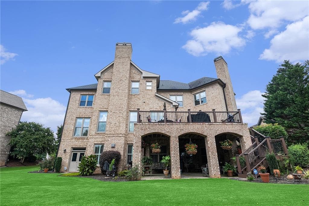 6 bedroom, 7 bathroom, 6,598 sq ft single family residence for sale at 2088 Skybrooke Court, Hoschton, GA 30548 — photo 2