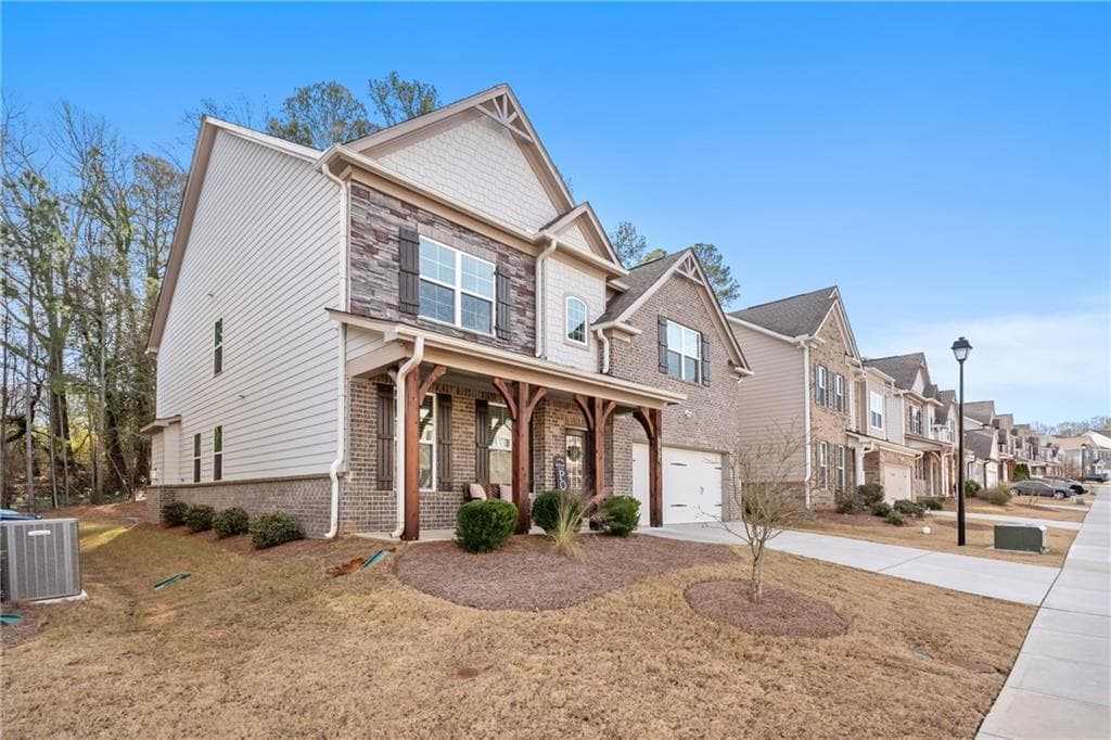 6 bedroom, 4 bathroom, 3,721 sq ft single family residence for sale at 4437 Waxwing Street, Hoschton, GA 30548 — photo 4