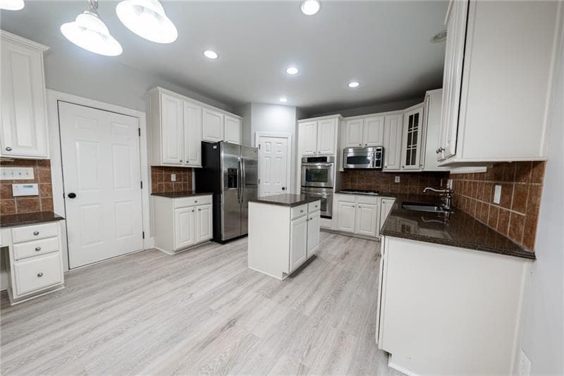 7 bedroom, 4 bathroom, 4,113 sq ft single family residence for sale at 3245 Sparling Street, Cumming, GA 30041 — photo 2