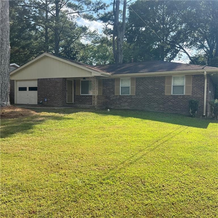 3 bedroom, 2 bathroom, 1,337 sq ft single family residence for sale at 6435 Connell Road, Atlanta, GA 30349 — photo 1 of 21