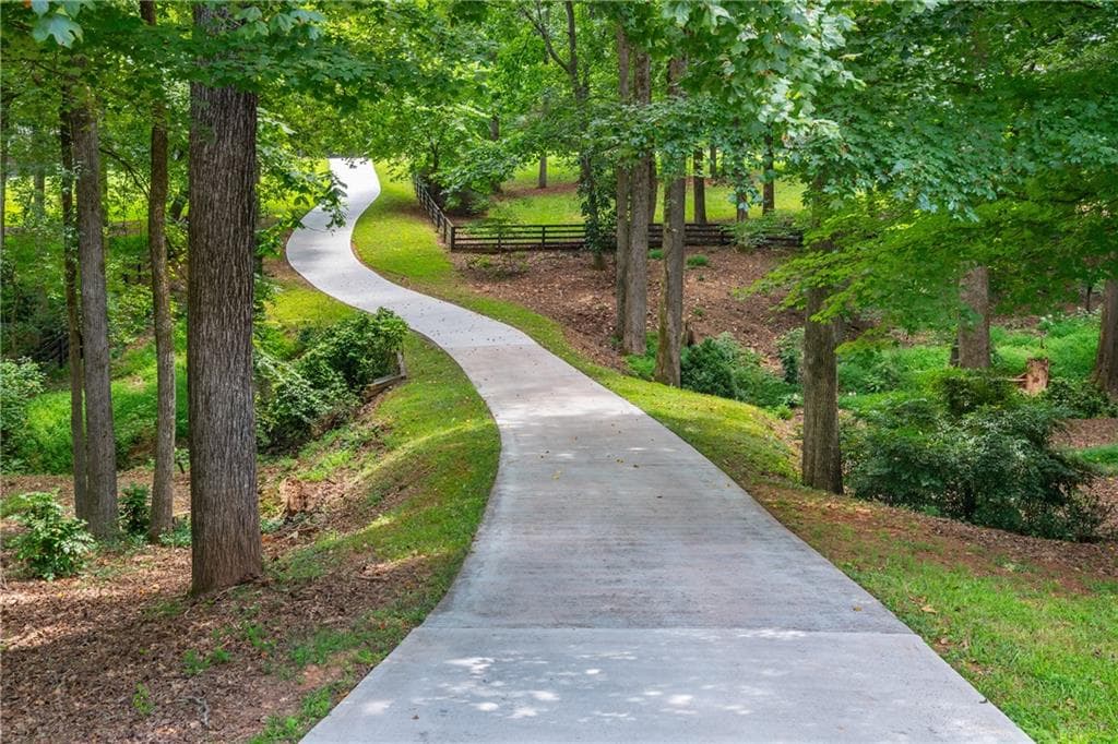 5 bedroom, 6 bathroom, 7,497 sq ft single family residence for sale at 910 Pleasant Hollow Trail, Milton, GA 30004 — photo 4
