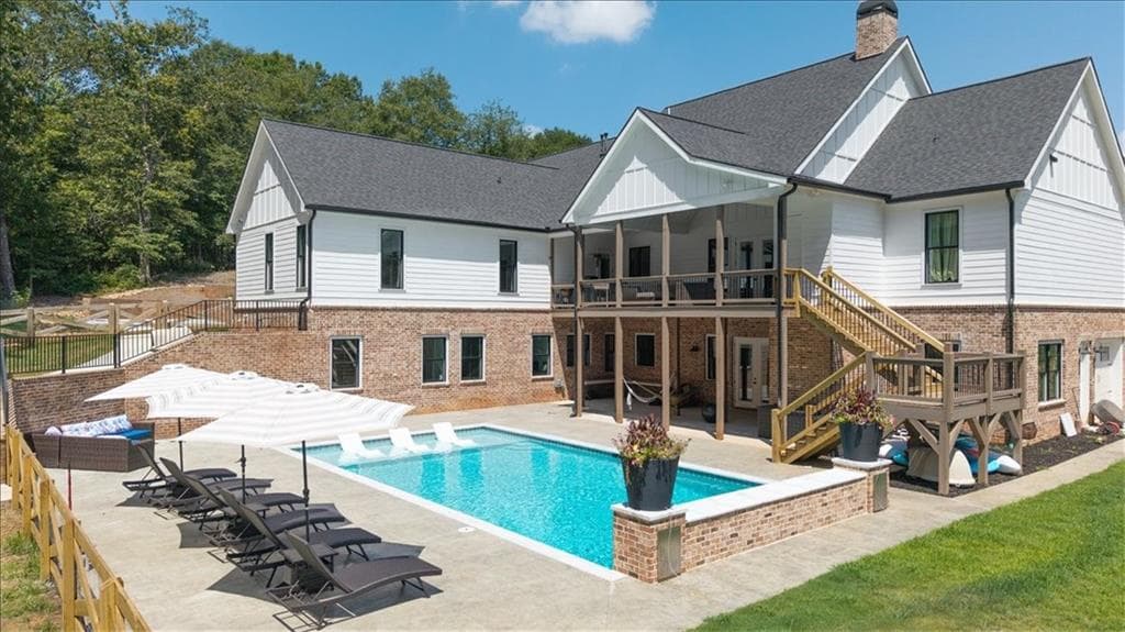 7 bedroom, 6 bathroom, 6,399 sq ft single family residence for sale at 1380 Cronic Town Road, Auburn, GA 30011 — photo 2