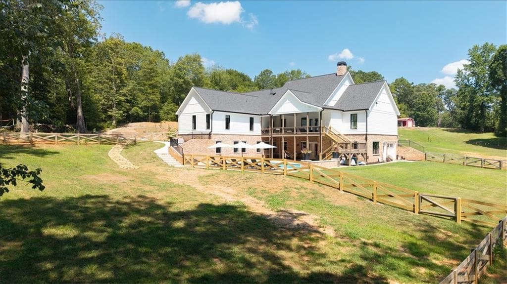 7 bedroom, 6 bathroom, 6,399 sq ft single family residence for sale at 1380 Cronic Town Road, Auburn, GA 30011 — photo 3