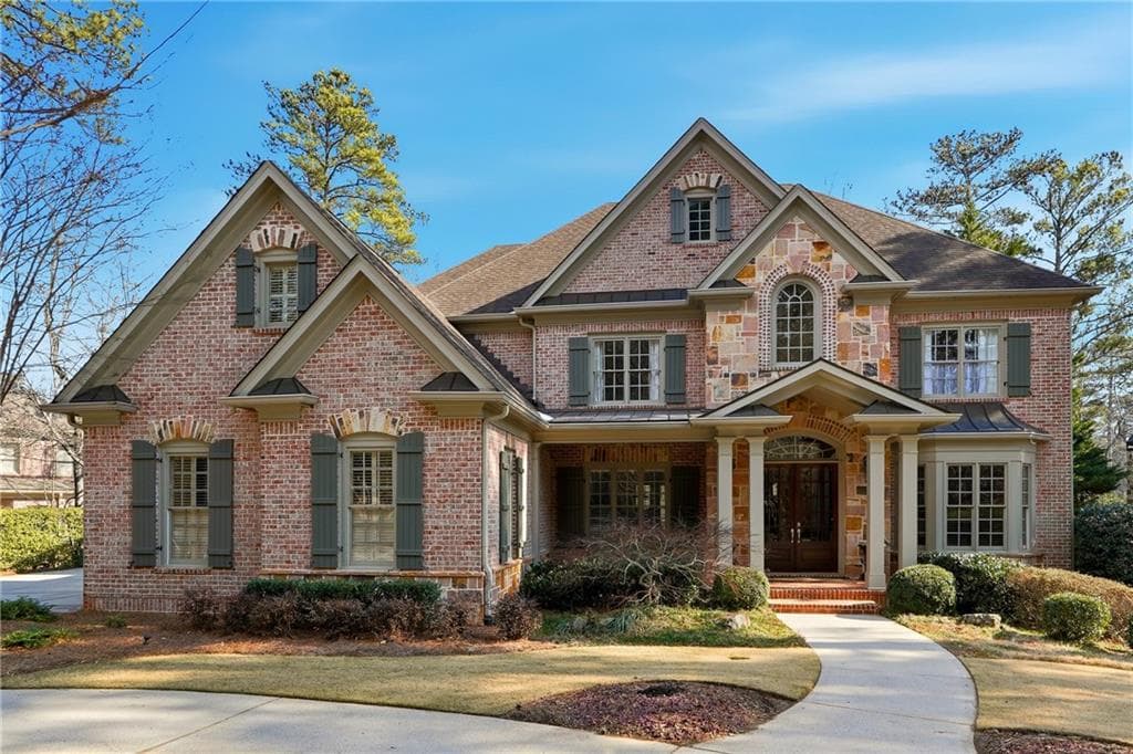 7 bedroom, 5 bathroom, 7,733 sq ft single family residence sold at 5430 Laurel Oak Drive, Suwanee, GA 30024