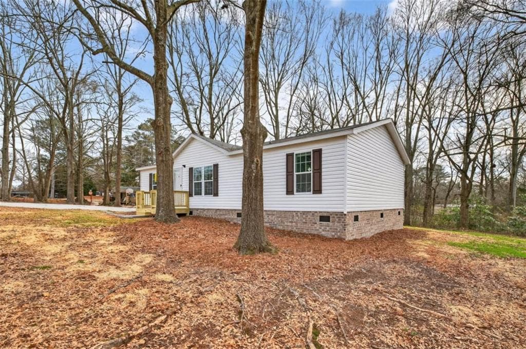3 bedroom, 2 bathroom, 1,344 sq ft single family residence for sale at 720 Woodland Circle, Loganville, GA 30052 — photo 3