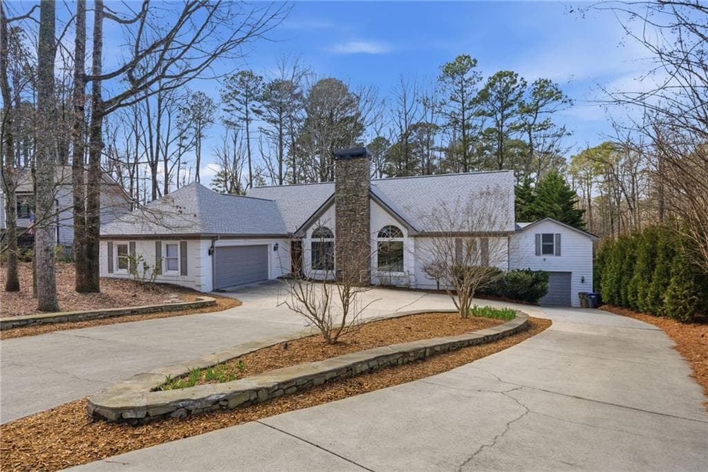 4 bedroom, 3 bathroom, 4,000 sq ft single family residence sold at 6120 Woodlake Drive, Buford, GA 30518