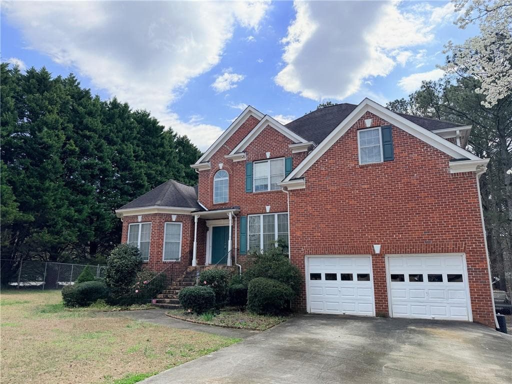 6 bedroom, 5 bathroom, 5,530 sq ft single family residence for sale at 2100 Skyland Cove Lane, Snellville, GA 30078 — photo 2