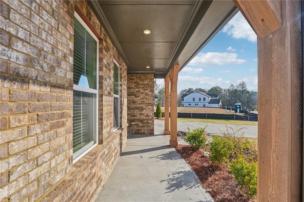 5 bedroom, 4 bathroom, 3,100 sq ft single family residence for sale at 7650 Homer Drive, Cumming, GA 30028 — photo 5