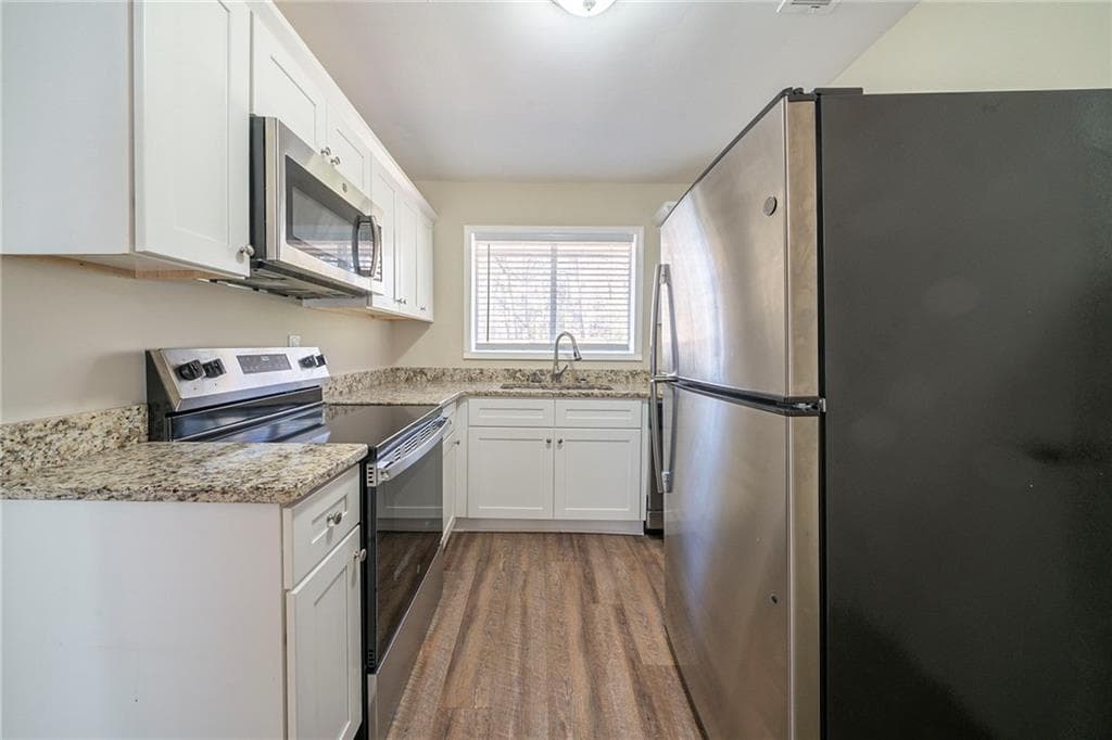 4 bedroom, 3 bathroom, 1,334 sq ft single family residence for sale at 1433 Dennis Drive, Decatur, GA 30032 — photo 2